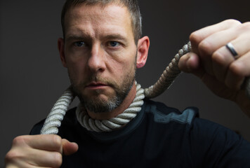 Overworked man with rope around neck. Mental health background