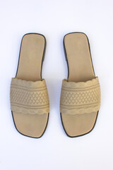 A brown women's open-toed sandal. These sandals are made of synthetic canvas.