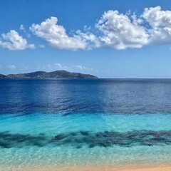 Fototapeta premium A high-resolution ultrarealistic photo captures a serene beach setting. The foreground features fine, golden sand with subtle shadows, giving a textured look. The middle ground showcases clear, turquo