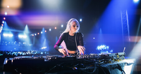 Establishing Footage with Professional DJ Equipment on a Club Stage. Mixing Decks, Controllers and...
