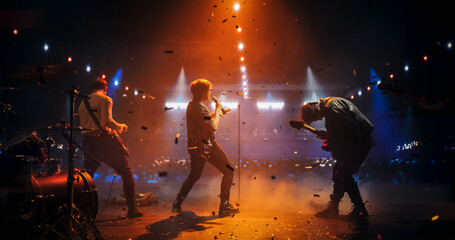 Professional Rock Musicians Performing a Live Set on Festival Stage, Playing Popular Rock Tracks in...
