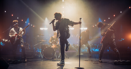 Rock Band Delivers a Captivating Concert with Lead Singer Passionately Performing on Stage with...