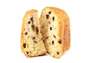 Pandoro with chocolate chips on white background. One slice and half sweet by its side