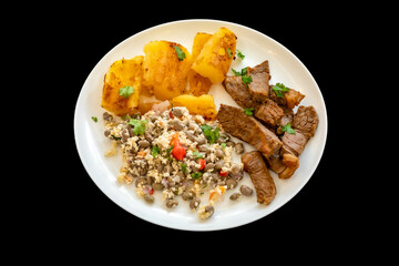 Traditional rustic tropical Brazilian dish, sun-dried beef with green beans, cassava, biquinho...