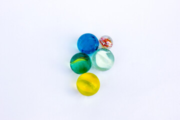 Colorful glass marbles isolated on a white background.