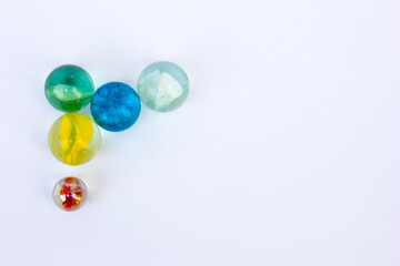 Colorful glass marbles isolated on a white background.