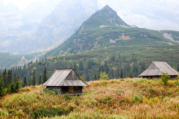 Two wooden cottage among the mountains