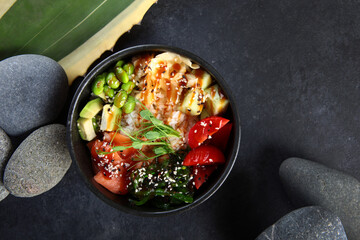 Poke salad with salmon and avocado. Delicious and hearty dish with red fish. Natural omega. Flat lay. Top view. Copy space.