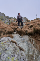 Man hiking in a cold day in the rocky mountains