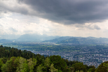 Fototapeta premium Look into the Valley of Bregenz with the famous Bodensee in the background at a cloudy summer day.