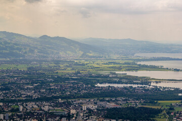 Fototapeta premium Look into the Valley of Bregenz with the famous Bodensee in the background at a cloudy summer day.