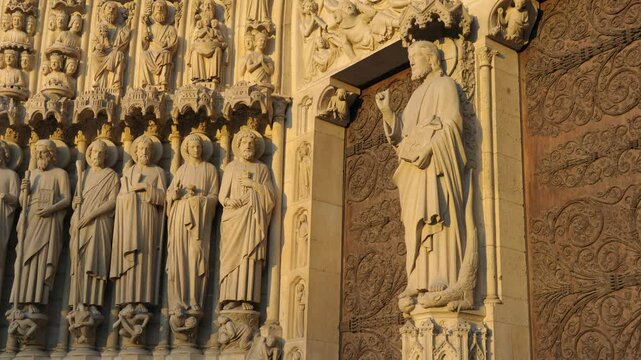 Carved figurines and the main entrance doors, Notre Dame Cathedral, Paris, &Icirc;le-de-France, France