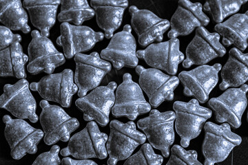 holiday christmas background silver bells full frame for ring in the New Year holidays backdrop smooth texture