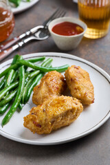 Portion of baked fried chicken