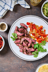Skirt steak with veggies, corn tortillas, guacamole and pico de gallo