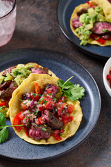 Skirt steak tacos with corn tortillas