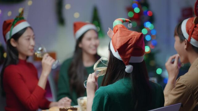 Friends join and celebrate the party with get cheers give a toast by clink glasses eating foods and drinks champagne. Happy and joyful in holiday weekend and festival.