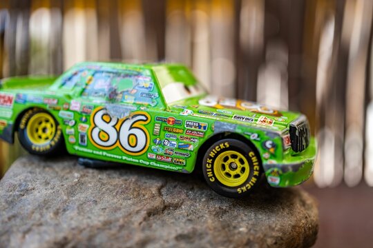 Mattel Chick Hicks toy model race car on a rock from the Disney Pixar Cars movie