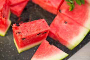 pieces of ripe red watermelon, close-up, on a board
