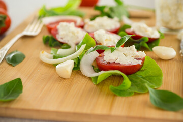 tomato wedges with cottage cheese filling and garlic, spicy appetizer