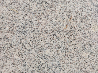 Close-up of grey granite floor.