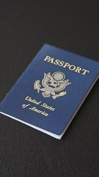 United states of america passport on a dark concrete background. Conceptual background on the theme of tourism and travel