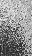 Ice texture close-up. Black and white monochrome. Selective focus