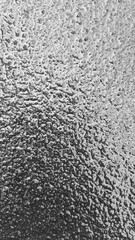 Ice texture close-up. Black and white monochrome. Selective focus