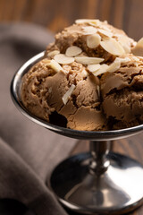 Balls of nut ice cream in a metal creamer