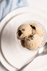 Coffee ice cream balls with notes of lavender in a beautiful cream bowl