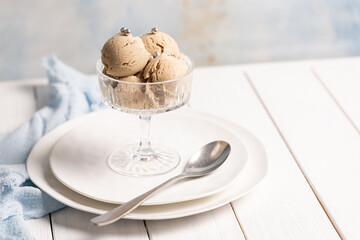 Coffee ice cream balls with notes of lavender in a beautiful cream bowl