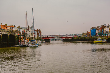 Naklejka premium Stunning photos of Whitby, the iconic coastal town in North Yorkshire, England, known for its scenic Whitby harbour, river Esk, and picturesque coast.