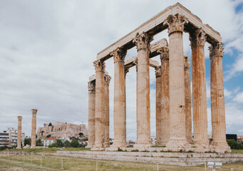Fototapeta premium Majestic Views of the Acropolis and Ancient Sites in Athens, Greece. These images showcase the historic sites surrounding the Acropolis, such as the Odeon of Herodes Atticus and the Ancient Agora.