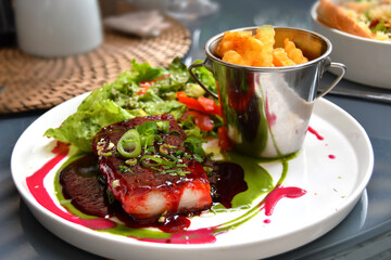 Pork brisket with salo served in Lithuanian restaurant