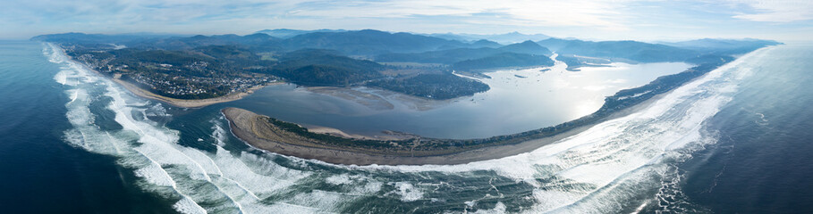 The Pacific Ocean washes against the sandy Salishan Spit, not far south of Lincoln City, Oregon....