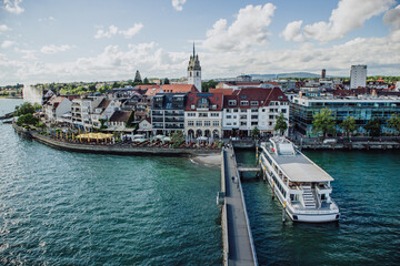 Fototapeta premium Discover the scenic charm of Friedrichshafen, on the shores of Lake Constance in Germany. These photos capture serene lake views, historic architecture, and inviting landscapes.