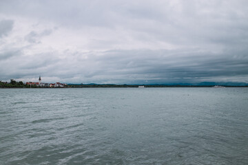 Obraz premium Discover the scenic charm of Friedrichshafen, on the shores of Lake Constance in Germany. These photos capture serene lake views, historic architecture, and inviting landscapes.