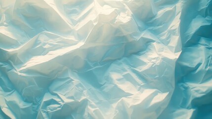 Obraz premium A crumpled paper texture with subtle shadows and highlights.