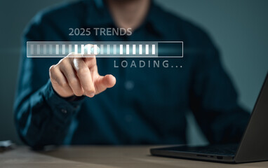goal, plan, progress, success, innovation, tech, analysis, loading, advertising, bar. A man is pointing at a bar 2025 trends Loading. Concept of anticipation and excitement for the future.