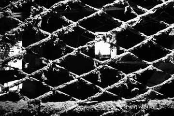 Scary dirty metal cage. Dark horror atmosphere.