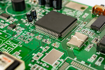 Obraz premium Close-up of a circuit board with microcircuits from an electrical appliance or computer.