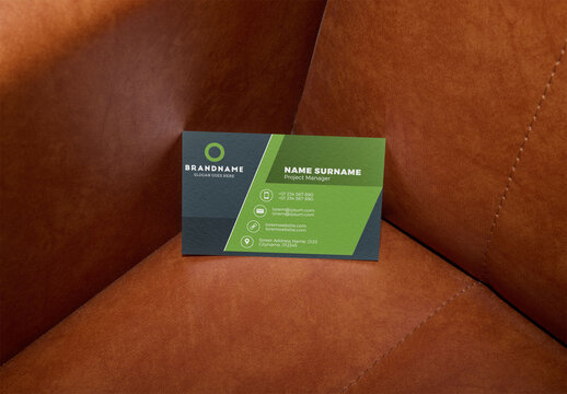 Business card on Brown Leather Couch. 88x55 