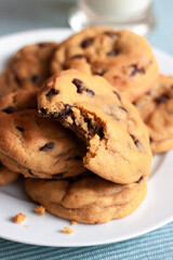 Plate of Chocolate Chip Cookies with Bite Missing
