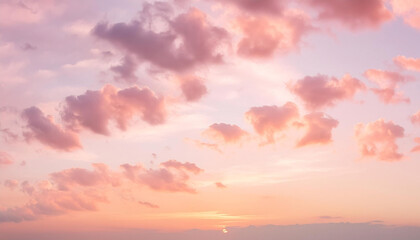 Fototapeta premium Vivid Sunset Sky with Soft Pastel Clouds in a Tranquil Atmosphere