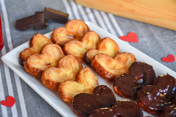 puff pastry in the shape of a heart or palm. dessert with chocolate