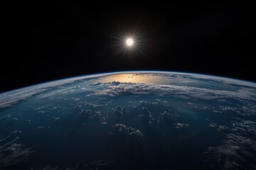 The picture captures a stunning view of Earth as seen from orbit during sunset, with the sun's brilliant rays reflecting off the planet's atmosphere and highlighting the clouds