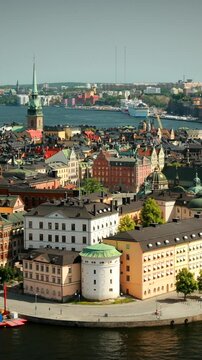 Stockholm, Sweden. Top View Of Building Of Riddarholm Kyrka Or Riddarholm, The Burial Place Of Swedish Monarchs On The Island Of Riddarholmen. Summer Sunny Cityscape Skyline. Gamla Stan Aerial Shot