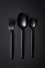 Elegant Black Cutlery Set on Dark Background: Minimalist Modern Design
