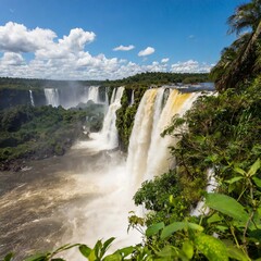 Fototapeta premium The Breathtaking Iguazu Falls on the Brazil-Argentina Border, Surrounded by Rich Rainforests and Home to Exotic Wildlife Species, Offering One of the Most Dramatic Natural Landscapes in South America