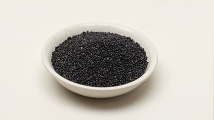Premium black sesame seeds on ceramic surface